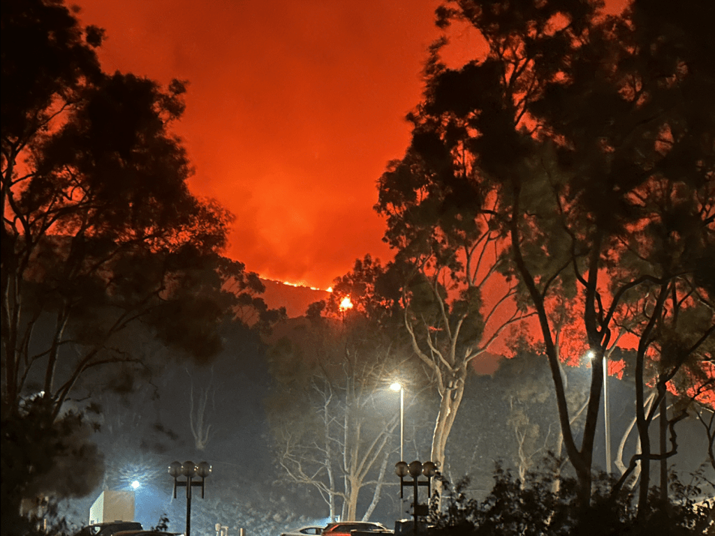 Flames moved closer to Pepperdine's campus. Students watched the fire from Payson Library.